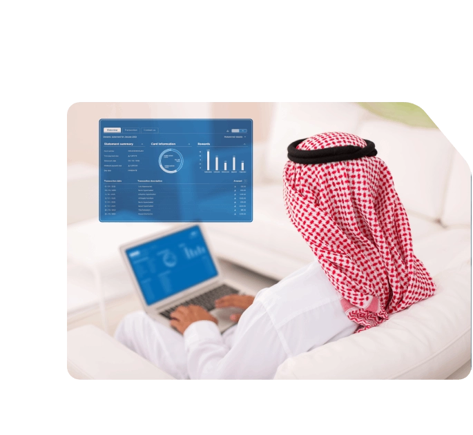 Saudi man using a laptop with a holographic Network dashboard showing account summary, card data, and transaction analytics.