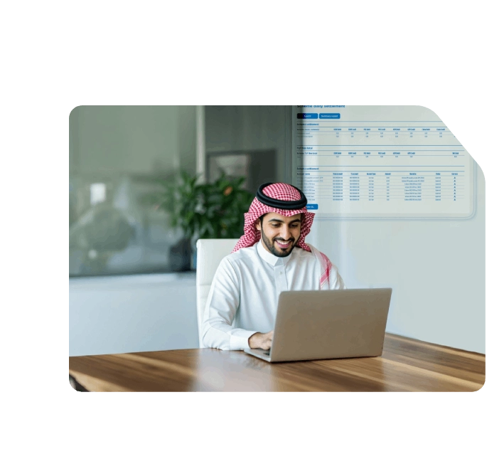 Smiling Saudi man using a laptop in an office, viewing a holographic Network transaction report or digital banking dashboard.